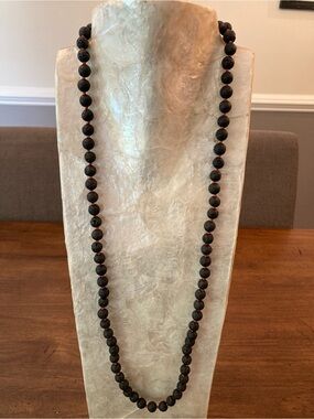 Matte Black Lava Beaded Necklace with Red knotting. 34”.